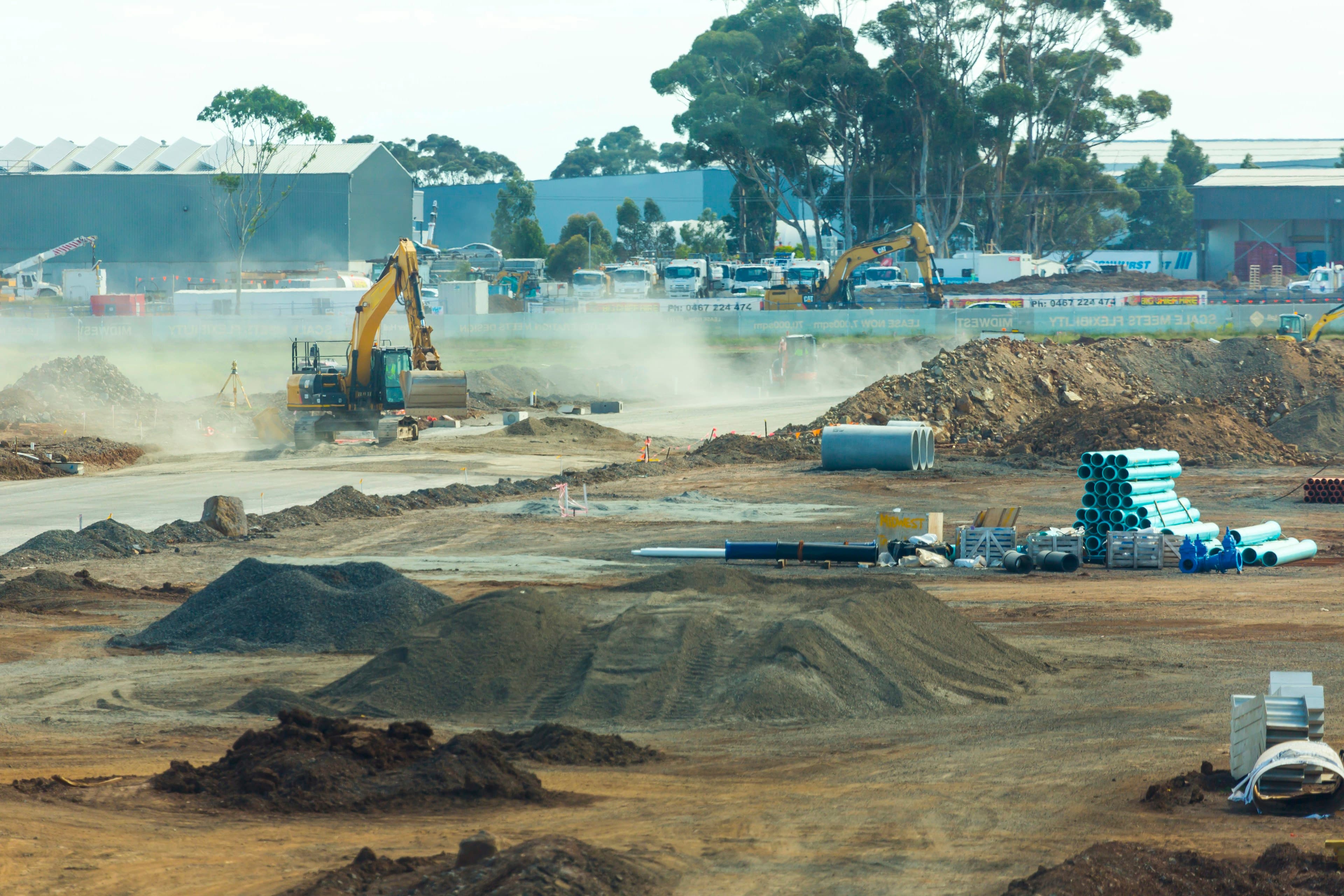 Construction site with earthworks and excavators