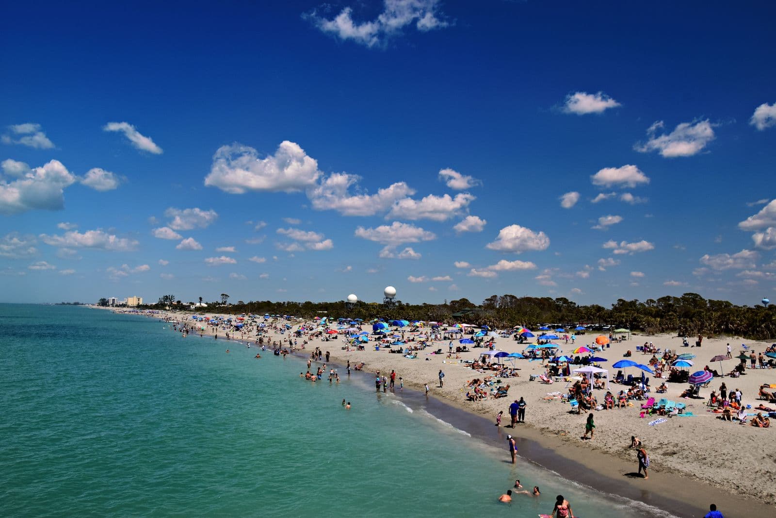 The coastline at Venice Beach, Florida, with turquoise water and beachgoers